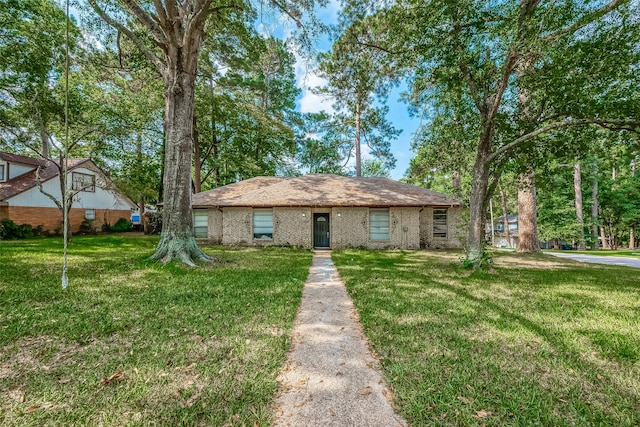 ranch-style home with a front yard