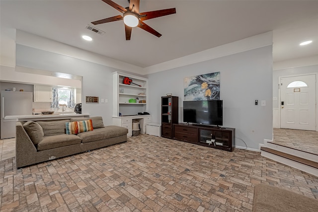 living room with ceiling fan