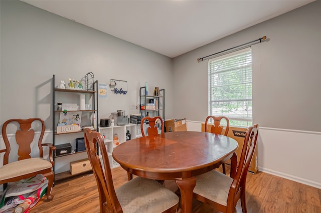 dining space featuring light wood-type flooring