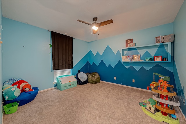 rec room with carpet floors and ceiling fan