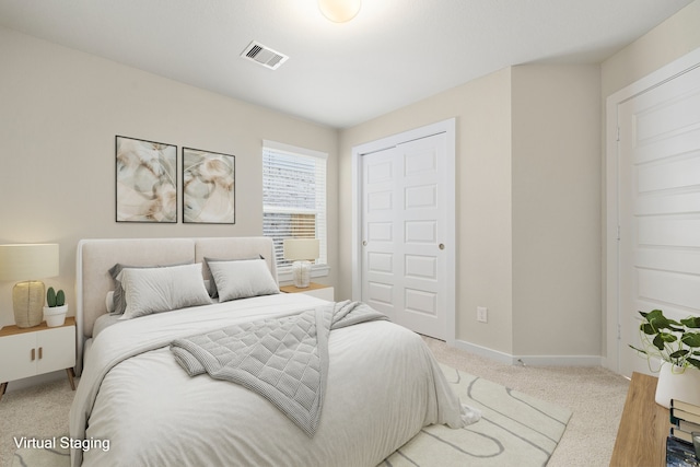 carpeted bedroom featuring a closet