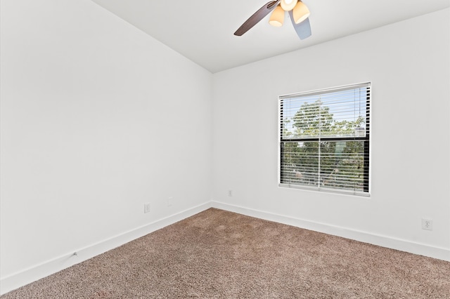 spare room with carpet and ceiling fan