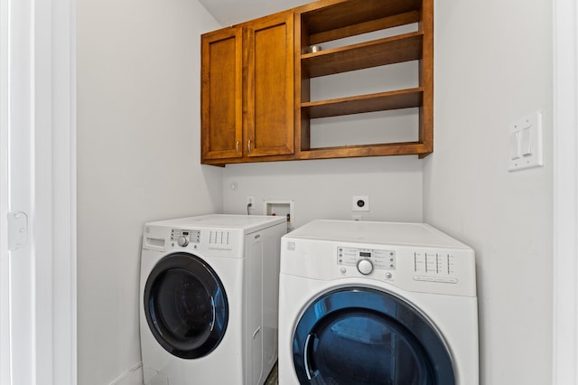 laundry area featuring cabinets and independent washer and dryer