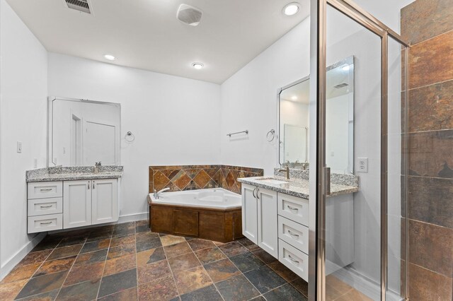 bathroom with shower with separate bathtub and vanity