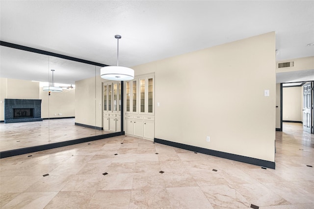 unfurnished dining area with a brick fireplace