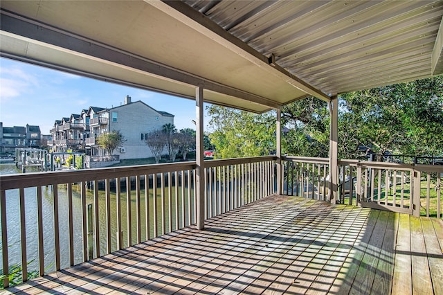 wooden deck with a water view