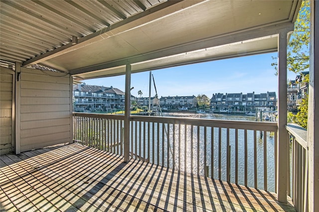 wooden terrace with a water view