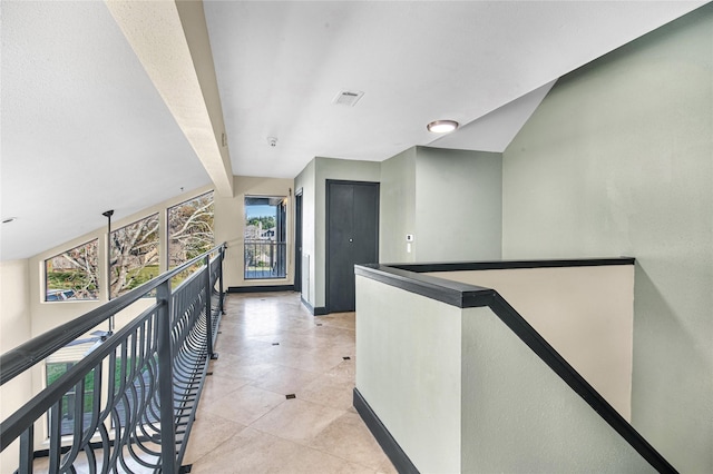 hallway featuring light tile patterned floors