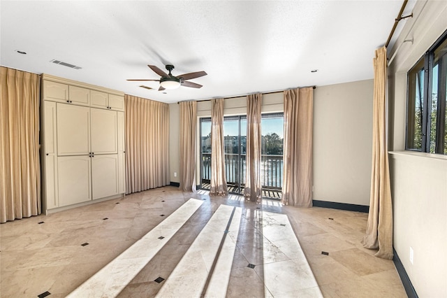 spare room with ceiling fan