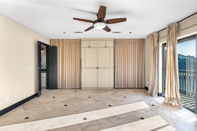 unfurnished bedroom featuring access to outside and ceiling fan