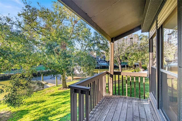 wooden terrace with a yard