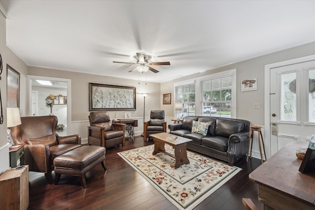 living room with dark hardwood / wood-style flooring and ceiling fan