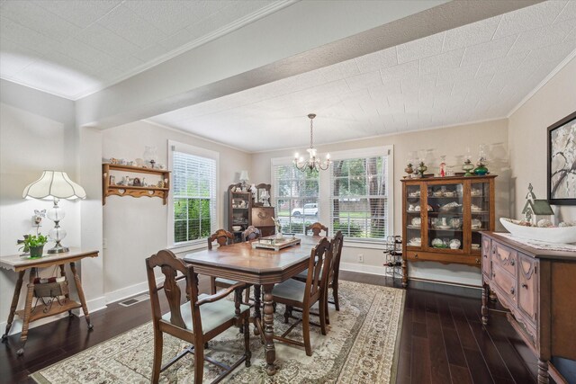 dining space featuring an inviting chandelier, dark wood-type flooring, and ornamental molding