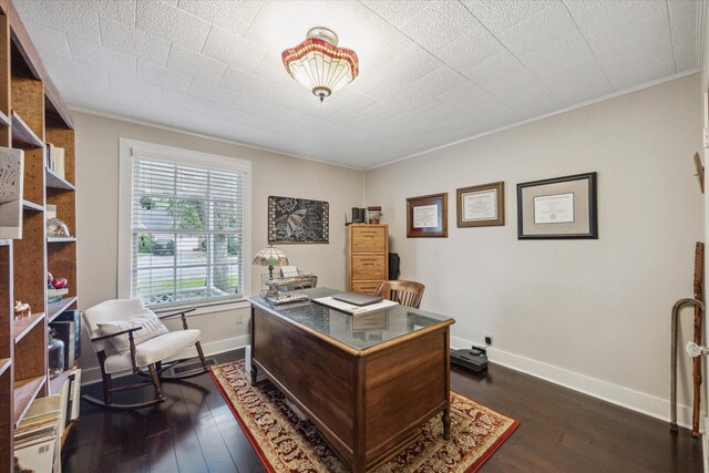 office with ornamental molding and dark hardwood / wood-style floors