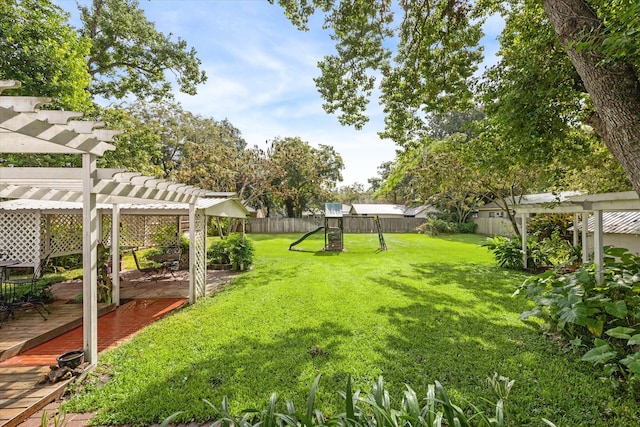 view of yard featuring a pergola, a playground, and a deck