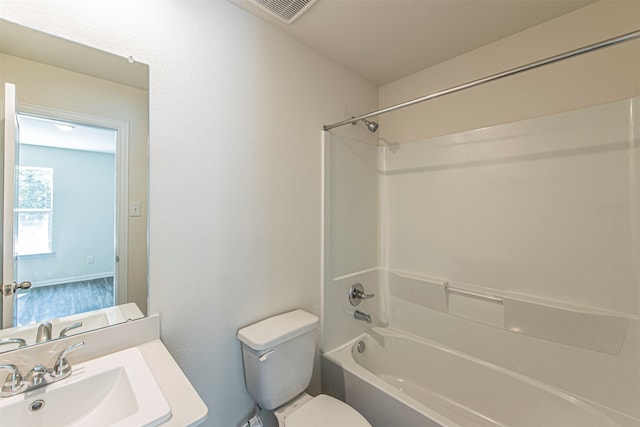 full bathroom with sink, shower / bathing tub combination, and toilet