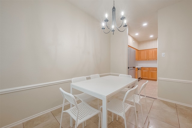 tiled dining space featuring a chandelier