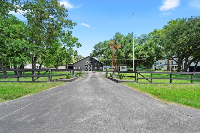 view of street featuring a gate