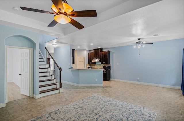 living room featuring ceiling fan and light tile patterned floors