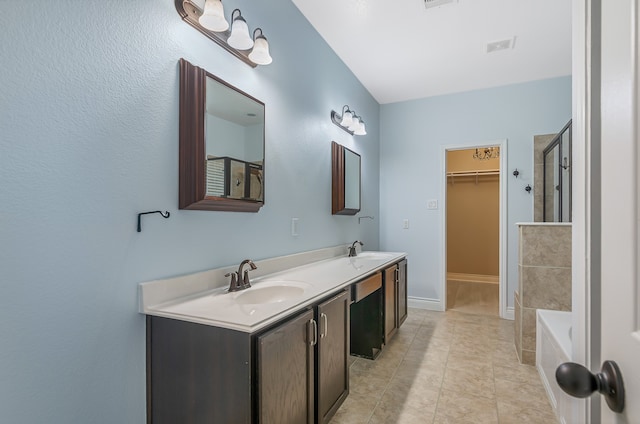 bathroom with vanity, tile patterned floors, and independent shower and bath