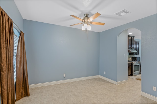 spare room with ceiling fan