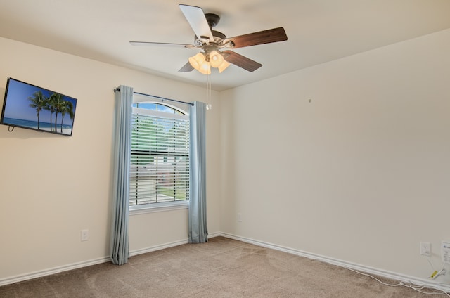 carpeted empty room with ceiling fan