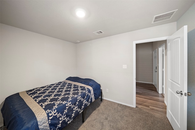 bedroom featuring dark wood-type flooring