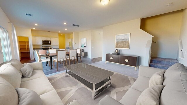 living room with light hardwood / wood-style flooring