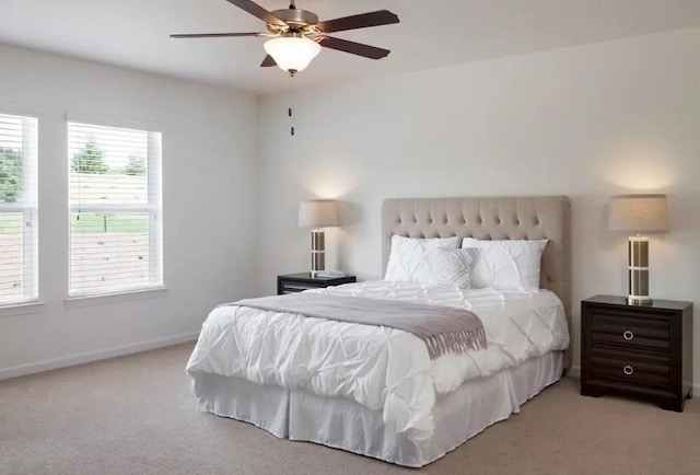 bedroom with light colored carpet and ceiling fan