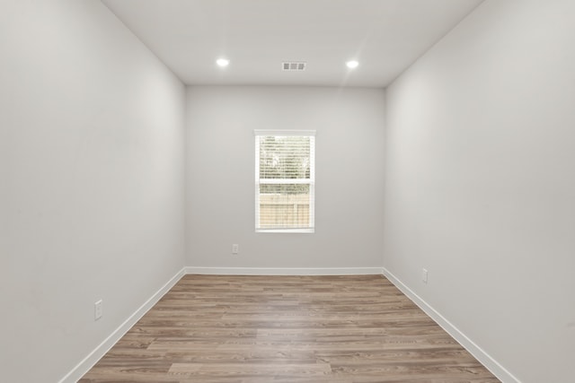 unfurnished room featuring light hardwood / wood-style floors