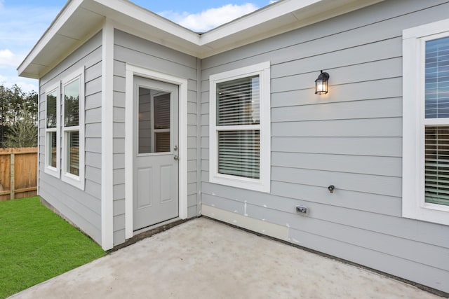 property entrance with a patio area