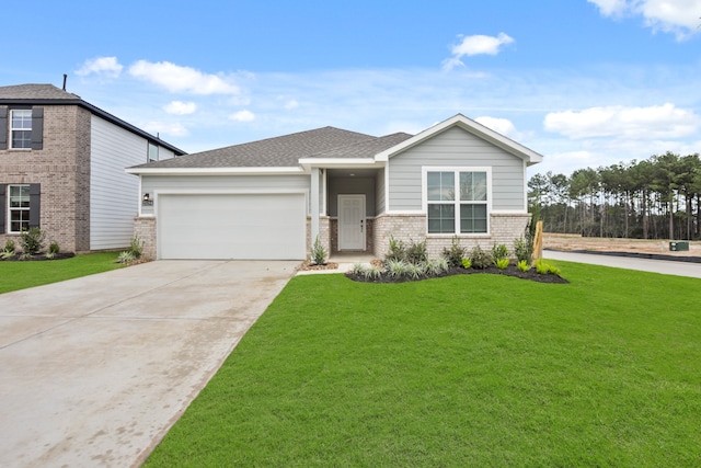 view of front of property featuring a garage and a front yard