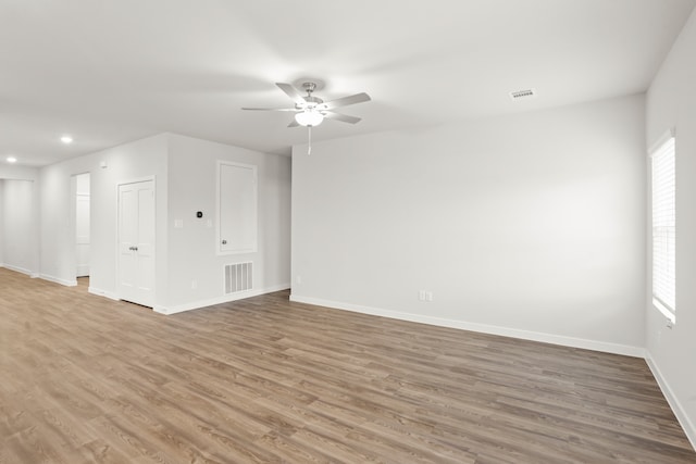 spare room featuring ceiling fan and hardwood / wood-style floors