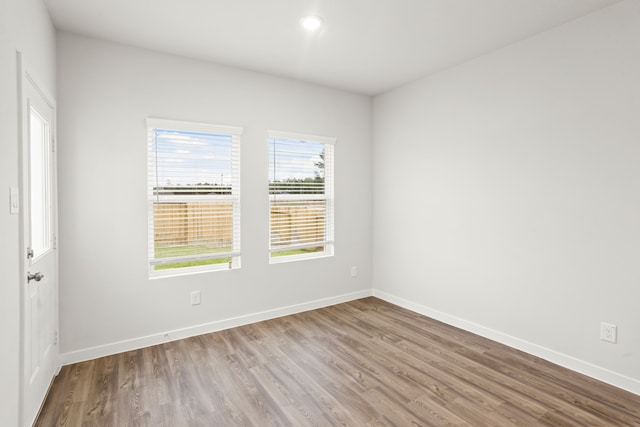 unfurnished room featuring light hardwood / wood-style flooring