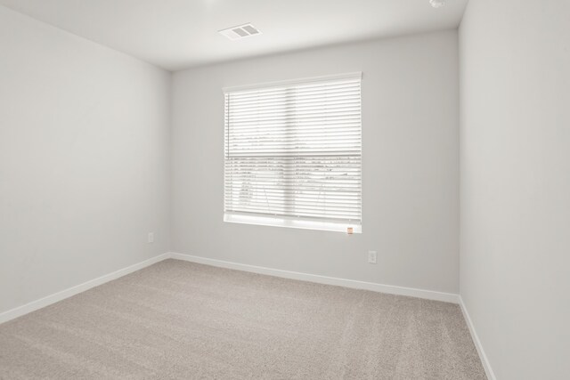 spare room with carpet floors