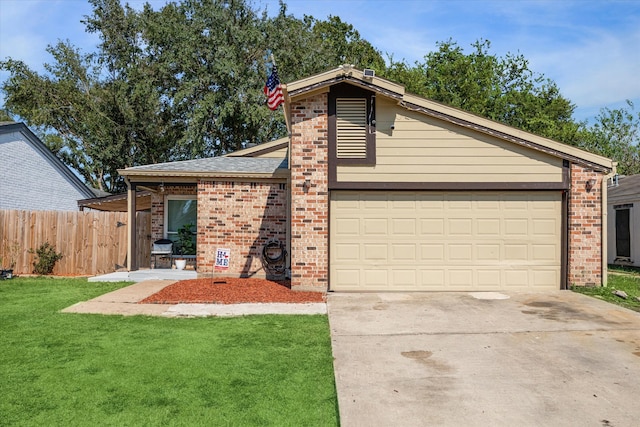 view of front of home with a front lawn and a garage