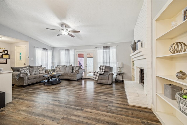11835 Sandpiper Dr, Houston, TX 77035 - living area with a ceiling fan, a textured ceiling, wood finished floors, a fireplace, and lofted ceiling