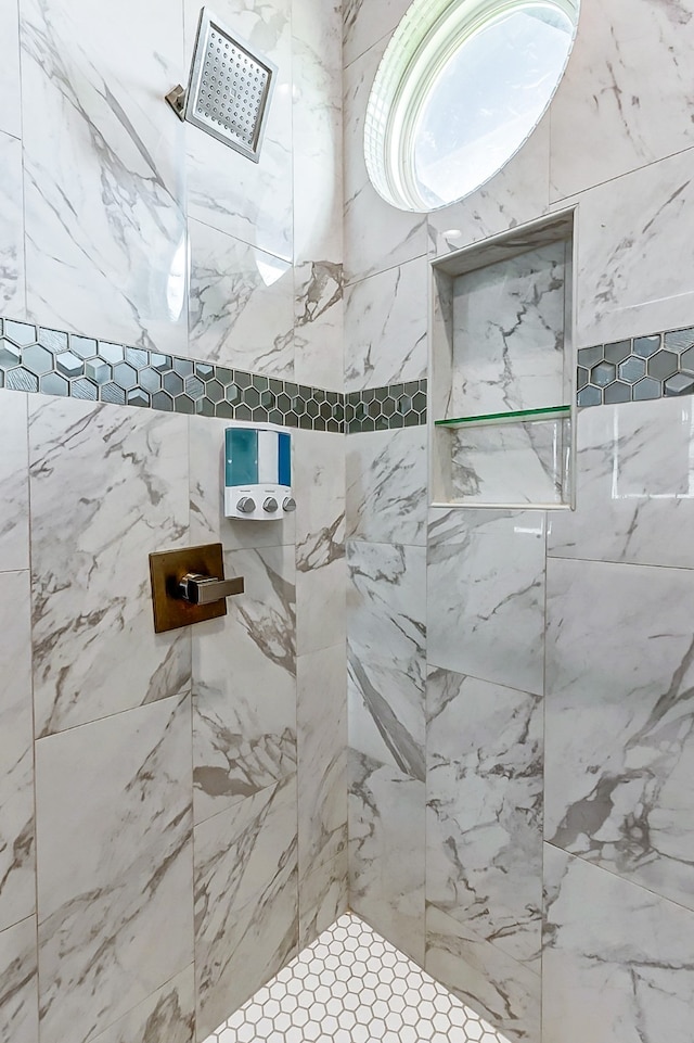 bathroom with tiled shower