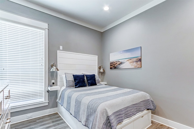 bedroom with light hardwood / wood-style floors