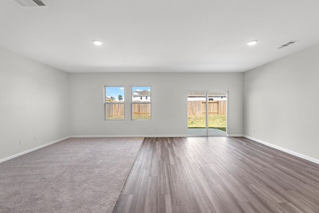 empty room with wood-type flooring