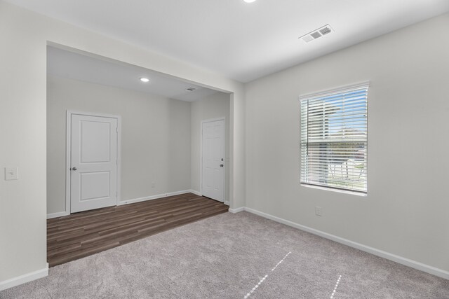 empty room featuring hardwood / wood-style flooring