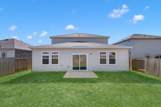 back of property featuring a patio and a lawn