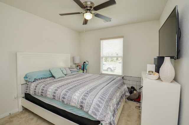 bedroom featuring ceiling fan and light colored carpet