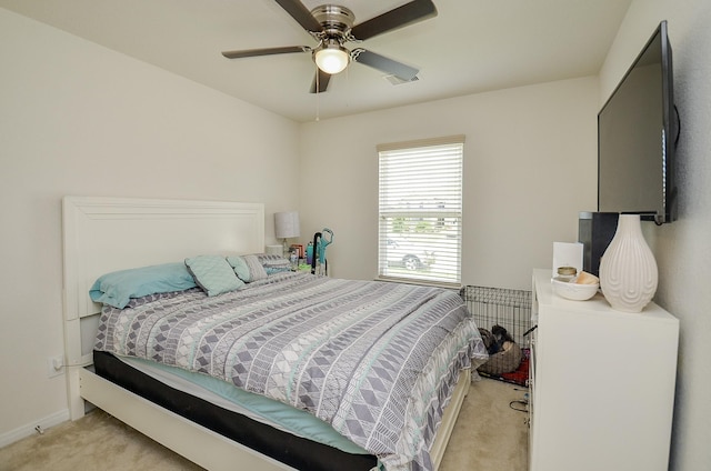 bedroom featuring carpet flooring, baseboards, visible vents, and ceiling fan