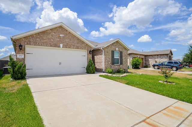 single story home featuring a garage, a front yard, and central air condition unit