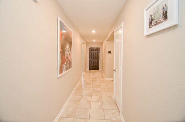 hallway with light tile patterned floors