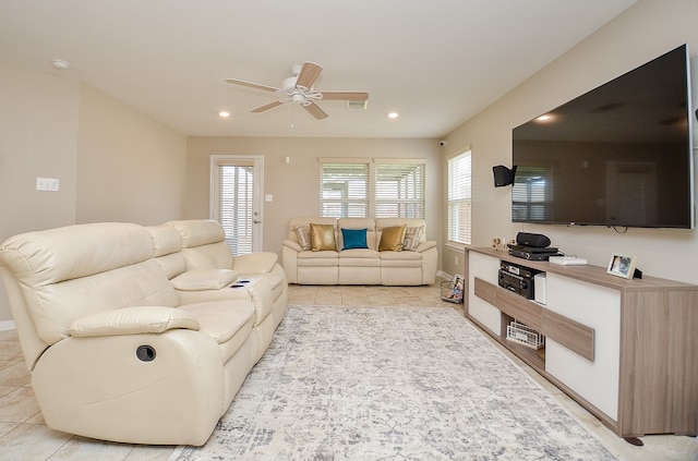 living room with ceiling fan and light tile patterned floors