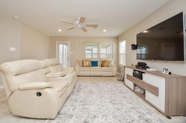 living area with light tile patterned flooring, recessed lighting, and a ceiling fan