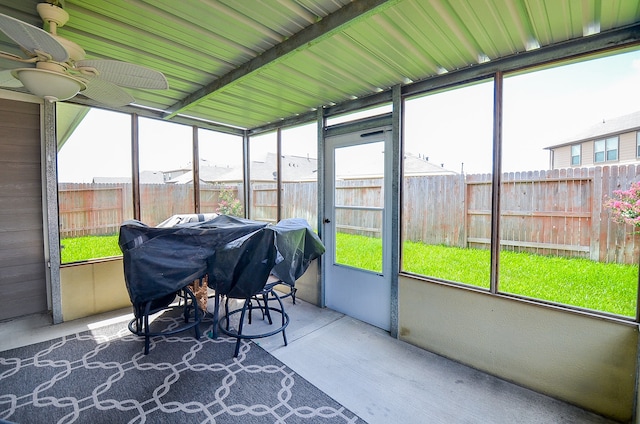 sunroom / solarium featuring ceiling fan and a healthy amount of sunlight