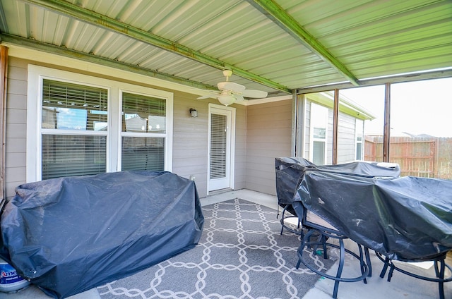 view of patio with a grill, ceiling fan, and fence